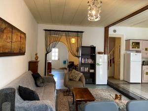 a living room with a couch and a table at Mytilini Townhouse in Mytilene