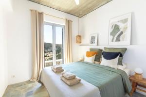 Ένα ή περισσότερα κρεβάτια σε δωμάτιο στο Villa Lefkos Lofos in Paros +18 φωτογραφίες