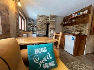 a living room with a table and a kitchen at Vlasinska Bajka in Vlasina Rid +41 photos