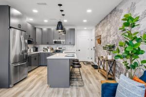 a kitchen with a stainless steel refrigerator and a counter at Jude's Respite in Traverse City