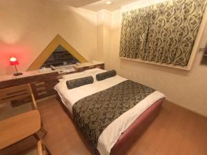 Postel nebo postele na pokoji v ubytování Hotel Sha A Nai Yan (Adult Only) + 5 fotografií