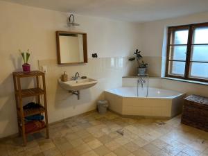 a bathroom with a tub and a sink at Einzeldenkmal in der Altstadt von Regensburg in Regensburg +63 photos