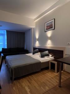 Postel nebo postele na pokoji v ubytování Pirita Beach Apartments & SPA