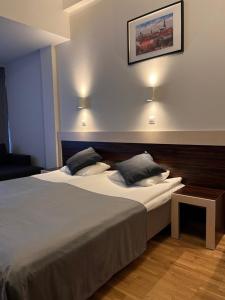 Postel nebo postele na pokoji v ubytování Pirita Beach Apartments & SPA