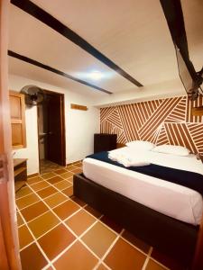 Postel nebo postele na pokoji v ubytování consorcio club Paradise