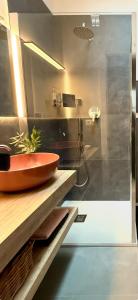 a bathroom with a red sink and a shower at Mood's Home BLQ in Bologna +8 photos