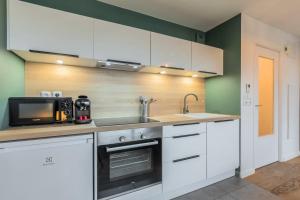 Kuchyň nebo kuchyňský kout v ubytování Appartement une chambre avec parking et terrasse + 12 fotografií