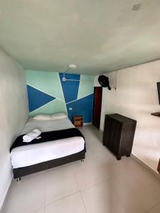 Postel nebo postele na pokoji v ubytování consorcio club Paradise