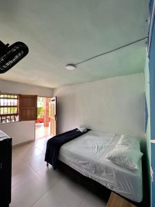 Postel nebo postele na pokoji v ubytování consorcio club Paradise