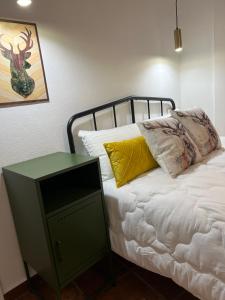 A bed or beds in a room at Alojamientos Rurales Cuatro Estaciones