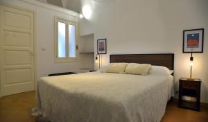 Ένα ή περισσότερα κρεβάτια σε δωμάτιο στο Dimora il Capitello