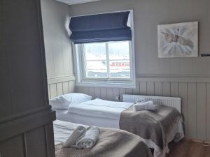 Postel nebo postele na pokoji v ubytování Vertshuset Fannarheimr - Bed &Breakfast