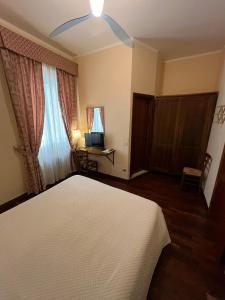 Posteľ alebo postele v izbe v ubytovaní Affittacamere Mazzini 78 + 29 fotografií