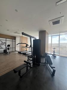 a gym with treadmills and exercise bikes in a room at Skytrees 公寓 距Aeon五分钟路程 in Johor Bahru