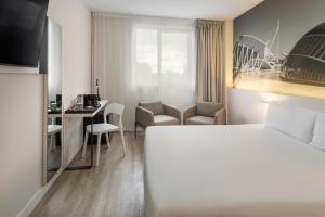 Postel nebo postele na pokoji v ubytování B&B HOTEL Valencia Ciudad de las Ciencias