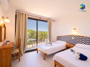 Ένα ή περισσότερα κρεβάτια σε δωμάτιο στο Apartamentos BELLA MARÍA +31 φωτογραφίες