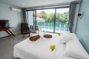 Ένα ή περισσότερα κρεβάτια σε δωμάτιο στο Seatherny Pool Villa +37 φωτογραφίες