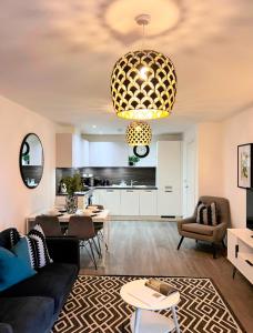 a living room with a couch and a table at Luxury Flat in Birmingham City West Midlands in Birmingham