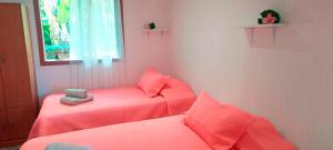 Cama o camas de una habitación en Kuhane Etno-Hostal