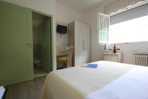 Postel nebo postele na pokoji v ubytování B&B Ortensia