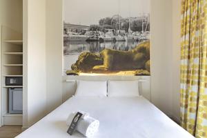 Кровать или кровати в номере B&B Hotel Savona