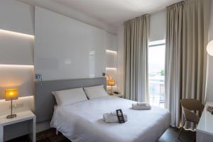 Кровать или кровати в номере B&B Hotel Savona