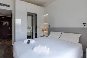 Кровать или кровати в номере B&B Hotel Savona