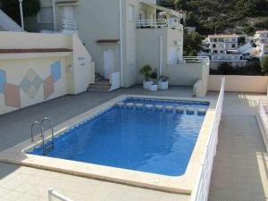 Bazén v ubytovaní A H RENTALS Montemar 8 apartamento alebo v jeho blízkosti