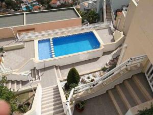 Bazén v ubytovaní A H RENTALS Montemar 8 apartamento alebo v jeho blízkosti