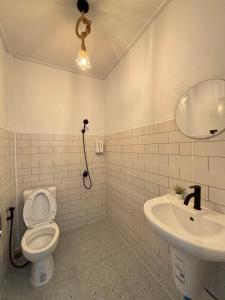 a bathroom with a toilet and a sink at P Vacation Libong in Ko Libong +79 photos