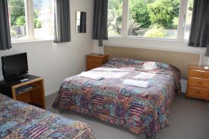 Postel nebo postele na pokoji v ubytování Ruapehu Mountain Motel & Lodge
