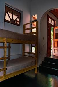 a bedroom with two bunk beds in a room at Hostel Hornocal in San Salvador de Jujuy