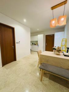 a room with a bed and a dining room at URBAN COZY HOME at SkySuites Near KLCC Complimentary Breakfast in Kuala Lumpur +26 photos