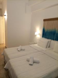 Postel nebo postele na pokoji v ubytování Hotel Pitsakis