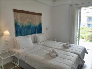 Postel nebo postele na pokoji v ubytování Hotel Pitsakis