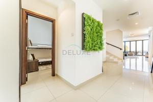a lobby with a large mirror and a plant on the wall at Overlooking Pool & Sea Views Villa with BBQ Facility, Sharm - Al Dana Villa, Al Dana Island by Deluxe Holiday Homes in Fujairah +46 photos