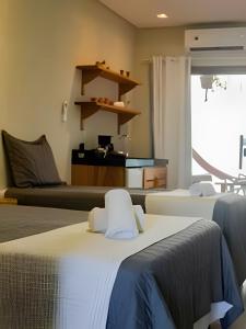 a room with two beds and a couch at Manga Verde Milagres in São Miguel dos Milagres +58 photos