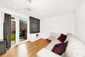 TV i/ili multimedijalni sistem u objektu The Tower Bridge Lodge