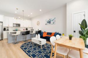 a living room with a blue couch and a table at Gilean Urban Retreat in Chicago