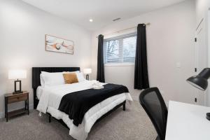a bedroom with a large bed and a window at Gilean Urban Retreat in Chicago