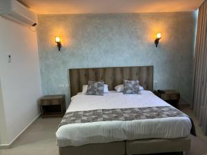 Ένα ή περισσότερα κρεβάτια σε δωμάτιο στο Jerusalem View Hotel