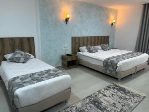Ένα ή περισσότερα κρεβάτια σε δωμάτιο στο Jerusalem View Hotel