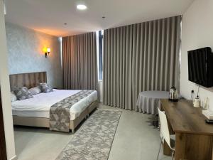 Ένα ή περισσότερα κρεβάτια σε δωμάτιο στο Jerusalem View Hotel