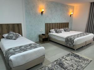 Ένα ή περισσότερα κρεβάτια σε δωμάτιο στο Jerusalem View Hotel