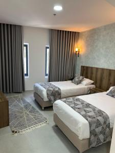Ένα ή περισσότερα κρεβάτια σε δωμάτιο στο Jerusalem View Hotel