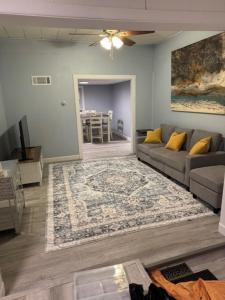 a living room with a couch and a rug at Pennsboro WV 'Country Roads' in Pennsboro
