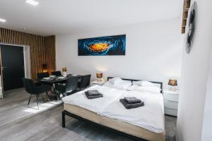 Katil atau katil-katil dalam bilik di Apartmány U Doskočilů