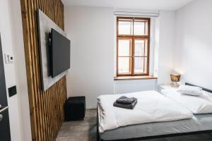 Katil atau katil-katil dalam bilik di Apartmány U Doskočilů