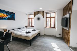 Katil atau katil-katil dalam bilik di Apartmány U Doskočilů