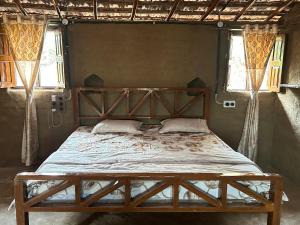 Postel nebo postele na pokoji v ubytování Narmada Homestay